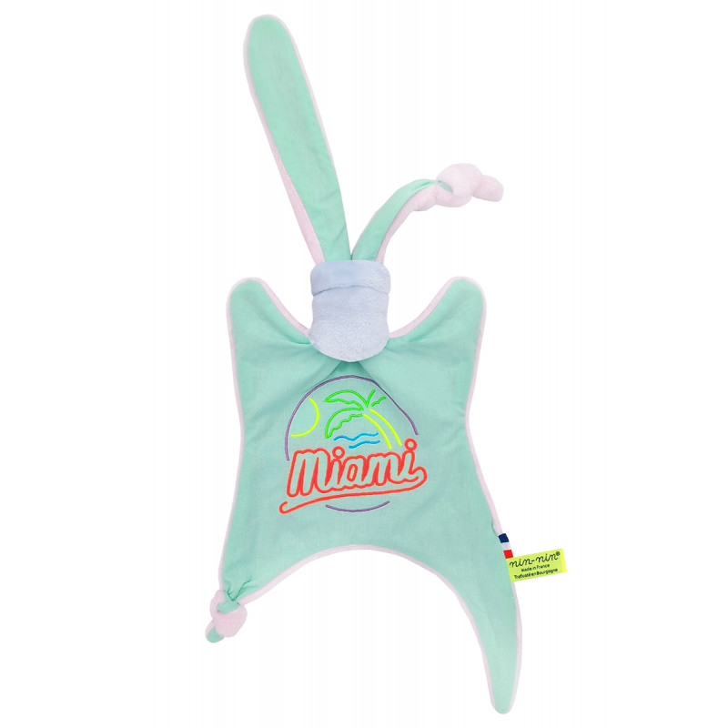 Doudou Miami. Cadeau de naissance personnalisé et made in France. Doudou Nin-Nin Doudou Miami. Cadeau de naissance personnalisé et made in France. Doudou Nin-Nin